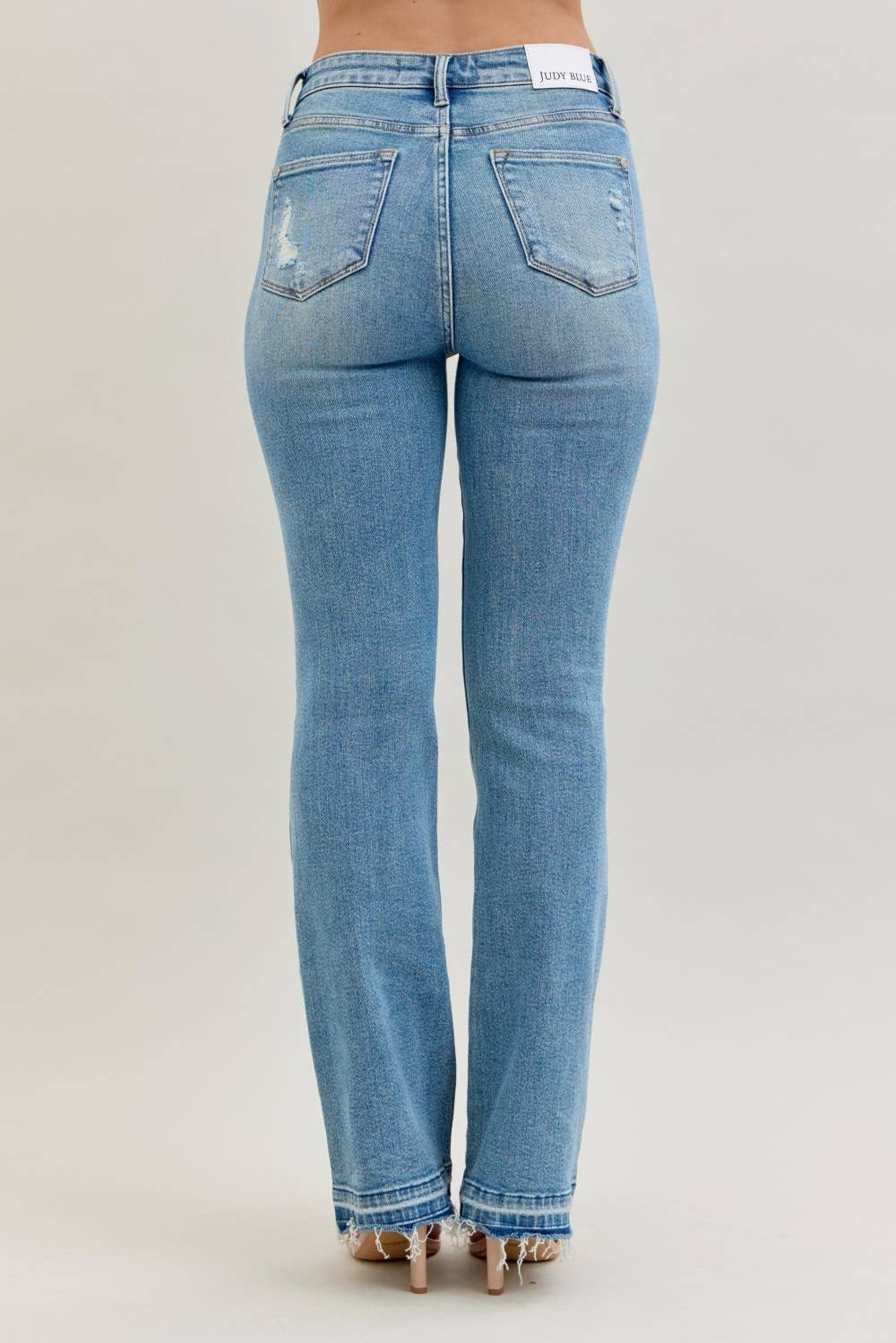 Blue jeans on a plain background
