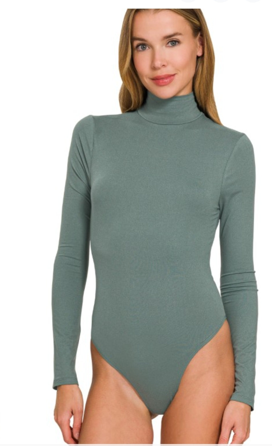 Woman wearing a green long-sleeve bodysuit on a white background