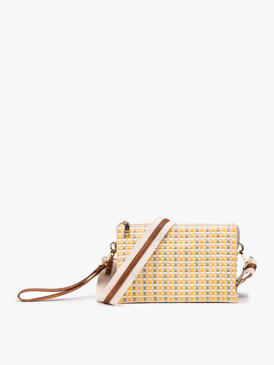 Yellow woven handbag with brown strap on a white background