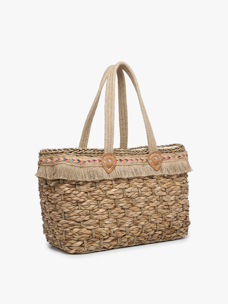 Woven handbag with fringe details on a white background