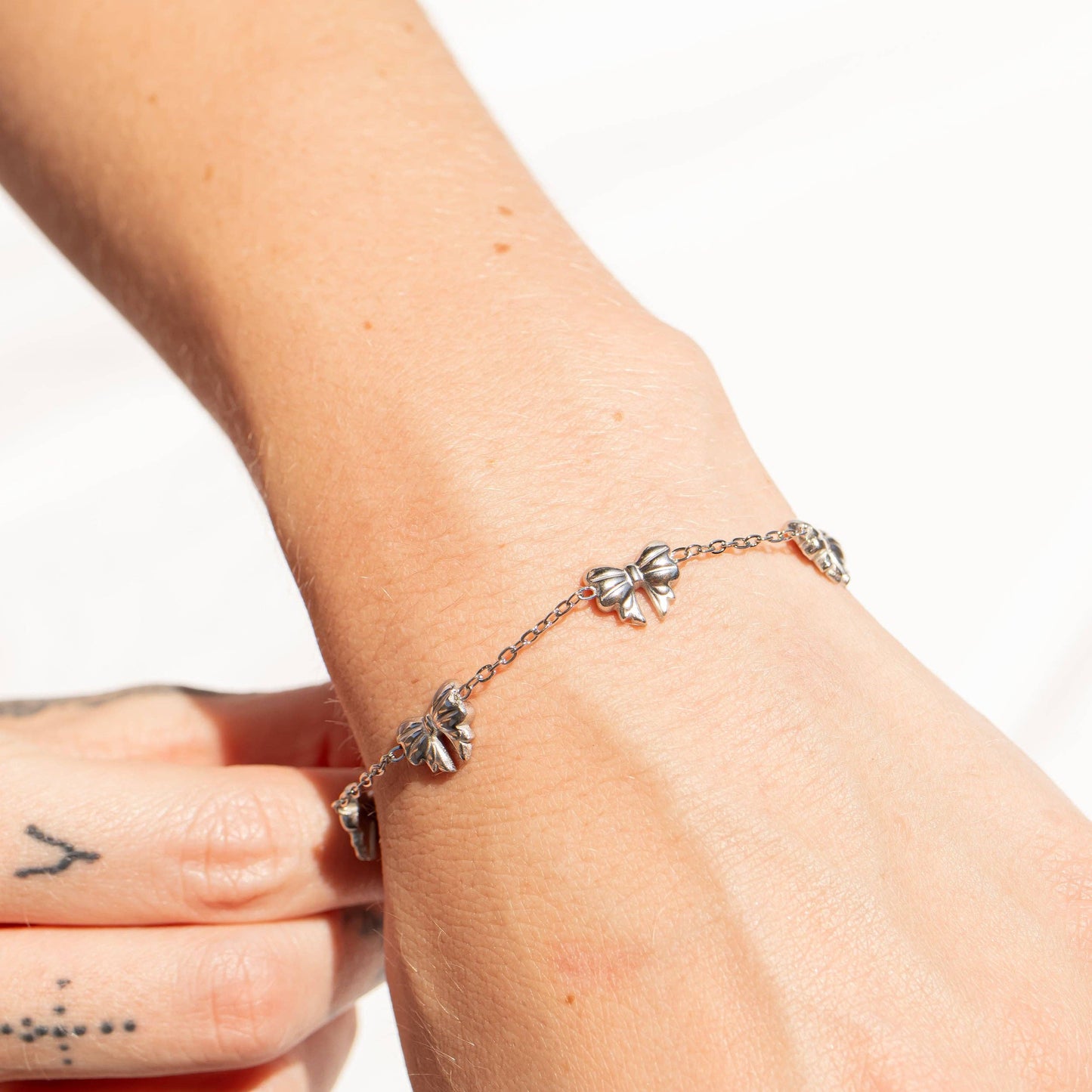 18K Gold PVD Stainless Steel Station Bow Charm Bracelet